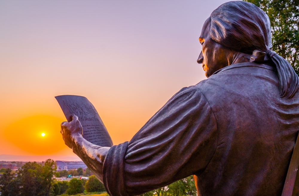 Picture of sunset behind statue of James Madison